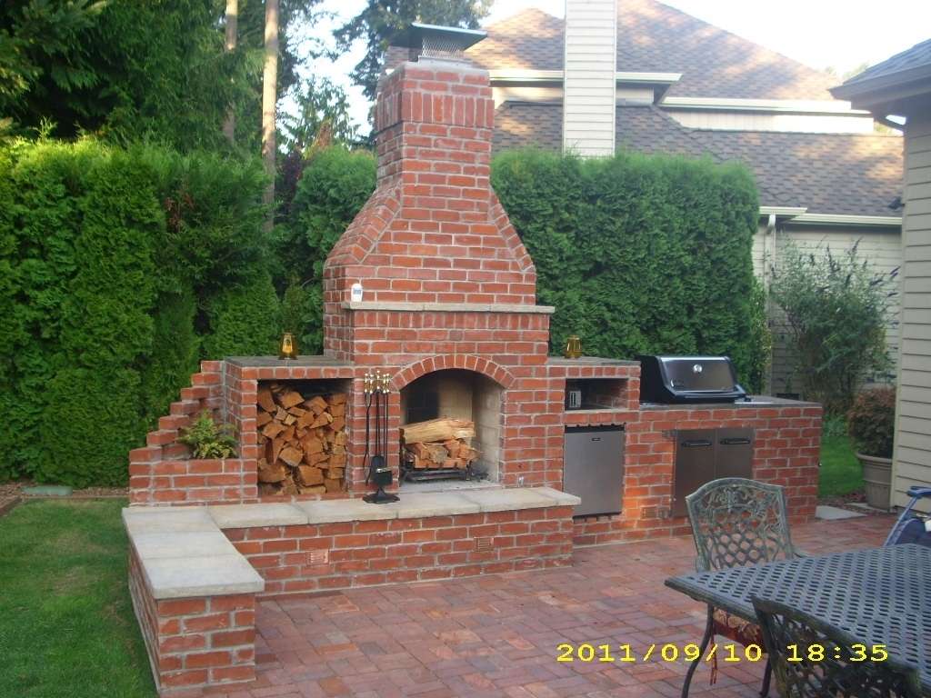 outdoor brick fireplace and grill